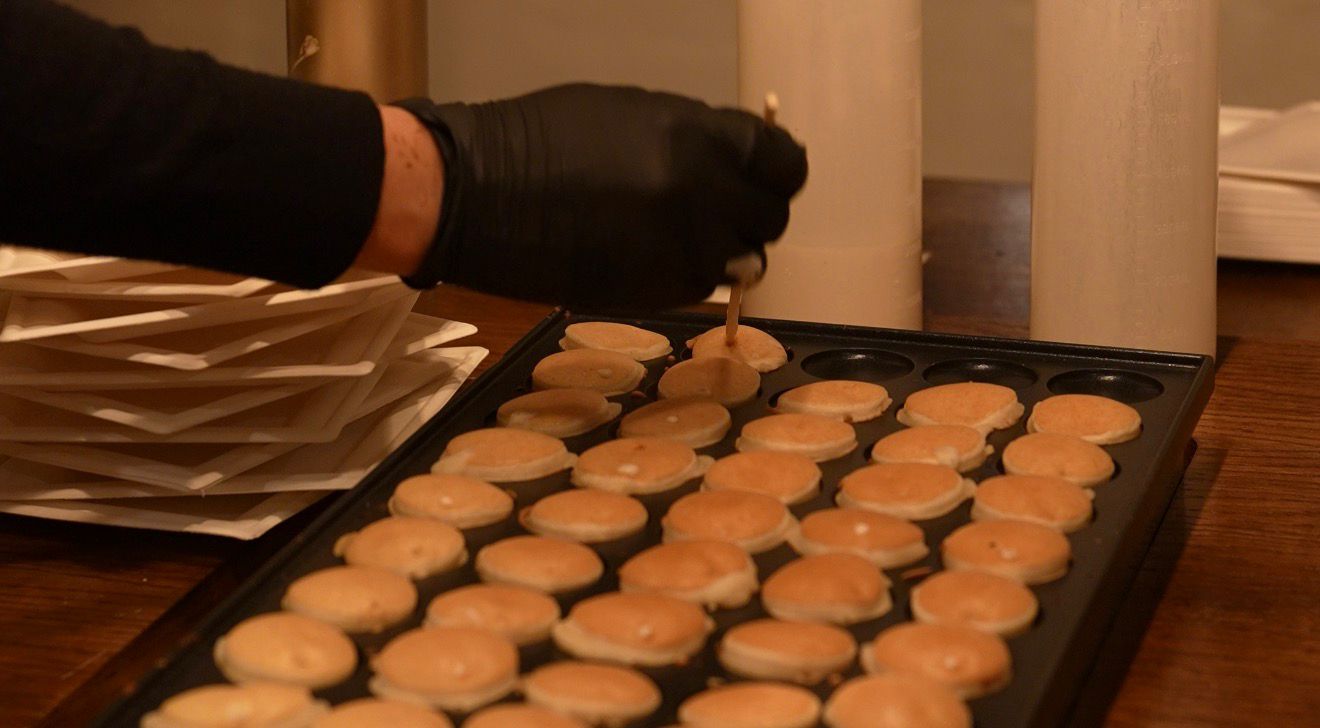 Mini Dutch pancakes being freshly made